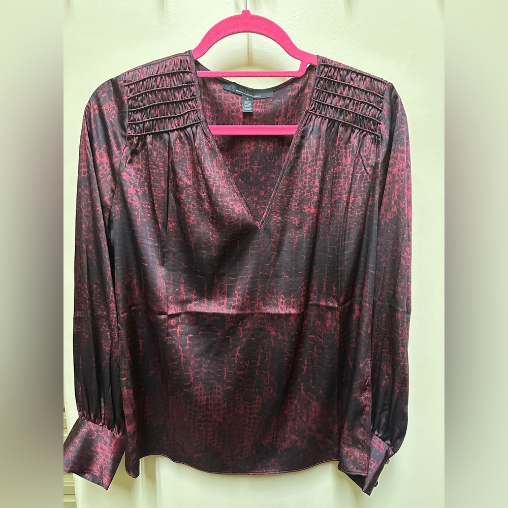 WHBM Smocked Shoulder Satin Blouse. Size small. Color is Black and a Brick Red